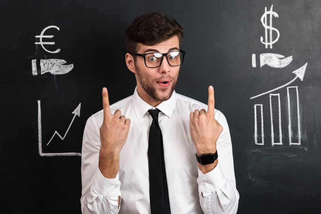 Surprised Handsome Young Man Glasses Pointing With Two Fingers Upward 2048x1365 1 1024x683